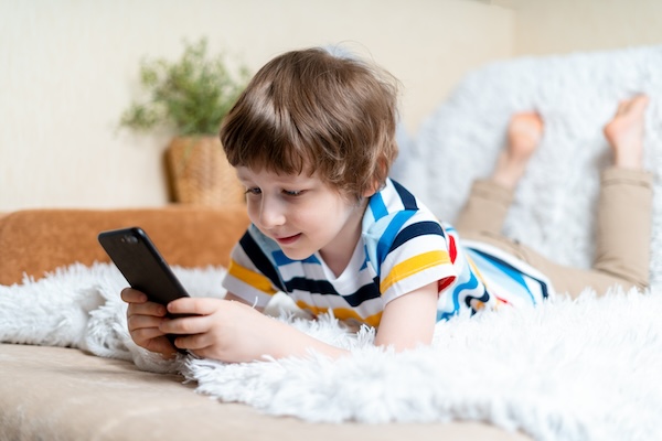 Child Reading on Phone
